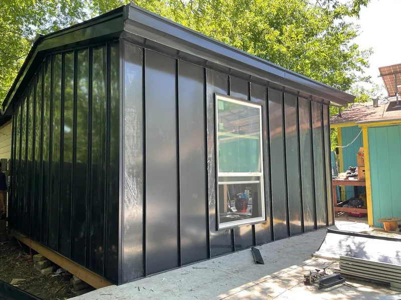Black standing seam metal wall panels for Roof Inspection in Malone