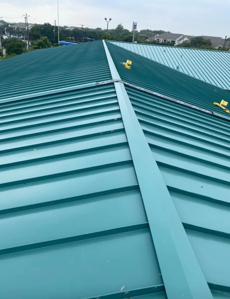 Green commercial metal roof ridge and valley for Metal Roof Repair in Malone